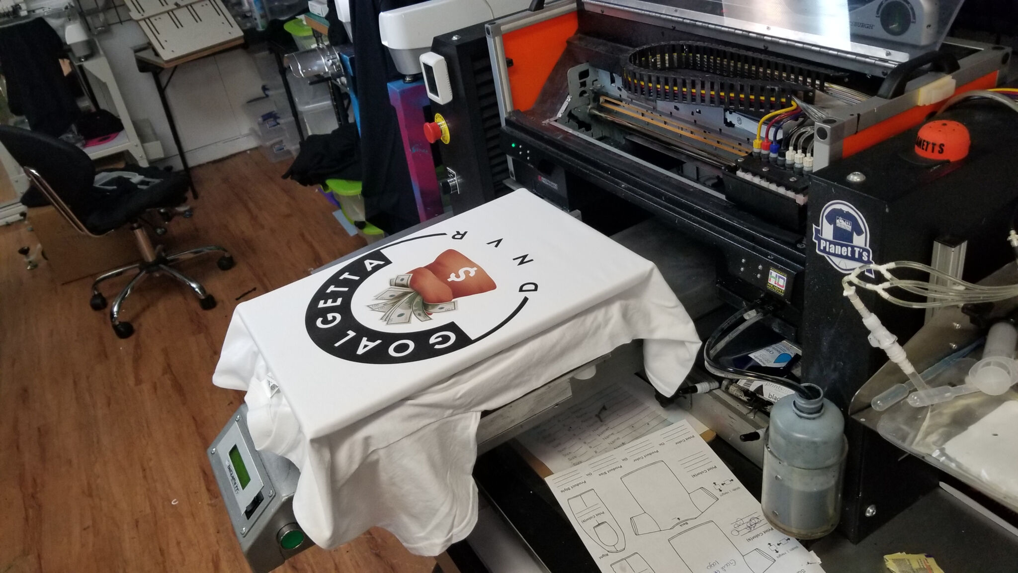 Fast custom t-shirt printing services at Planet T's